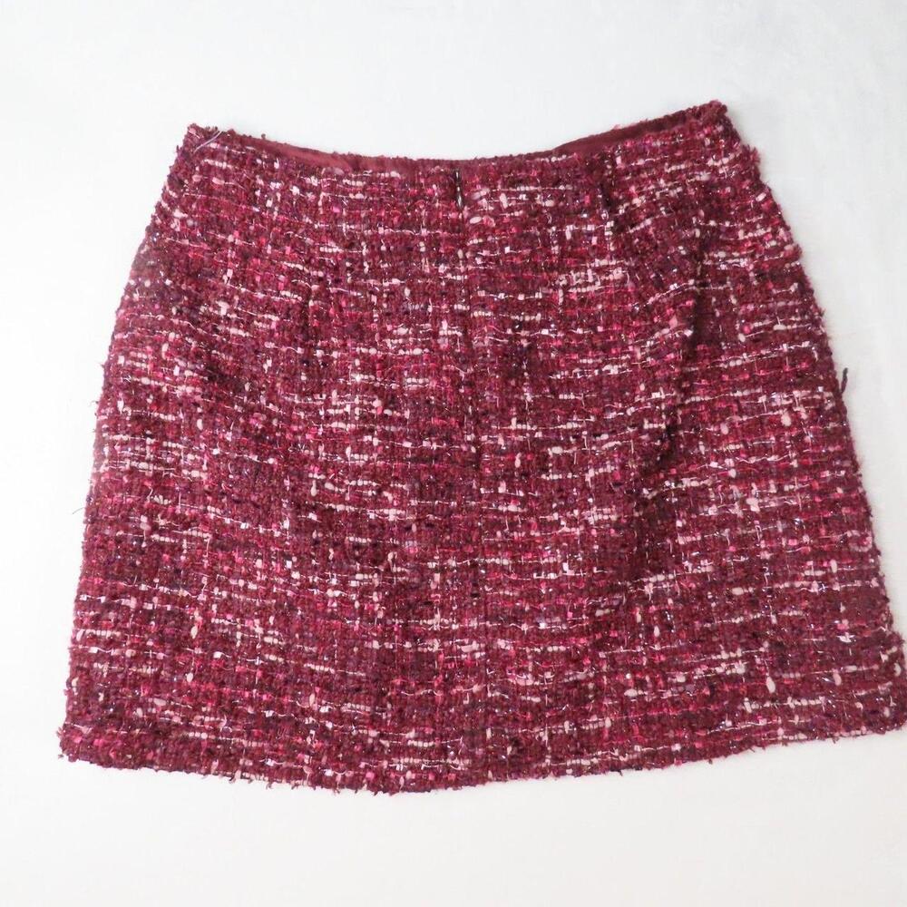 The House of Harlow 1960 Burgundy Tweed Bouclé Mini Skirt is a stylish and elega
